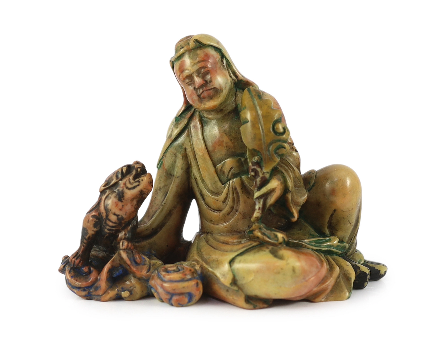 A Chinese soapstone group of a seated luohan and lion-dog, 19th/20th century